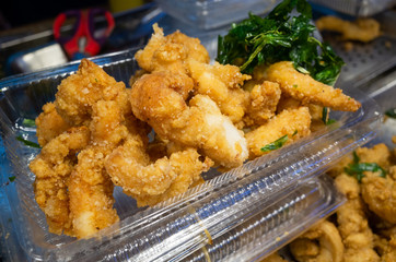 taiwanese fried chicken on a plate in the street