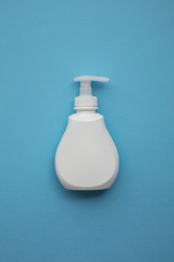 Bottle of anti bacterial handwwash on a blue background