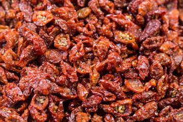 dried cherry tomatoes on the counter at the market