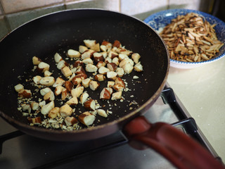 Roasting nuts in a frying pan