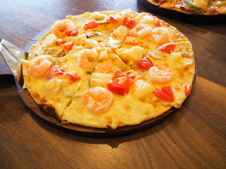 shrimp cocktail pizza on the table