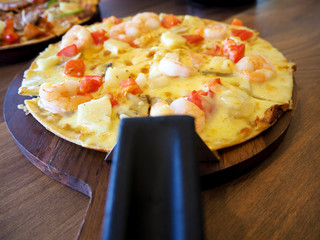 shrimp cocktail pizza on the table