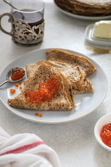 Traditional russian shrovetide crepes with caviar