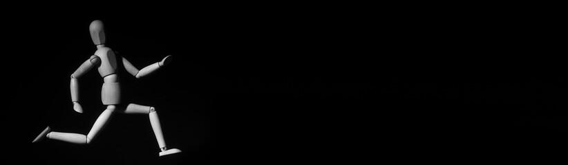 Wooden Human Mannequin Figure Model Running. Black and white