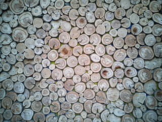 Lots of aged cracked wooden circular tree section with rings and texture placed on stone table with copy space