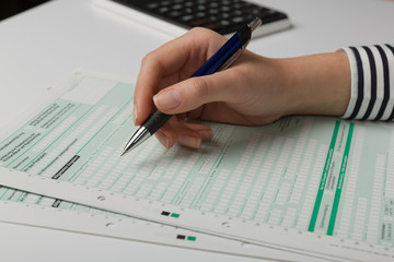 close up of filing a tax declaration with a pen