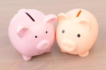 Piggy bank  on wooden background, space for text. Finance, saving money