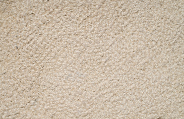 Rough limestone on wall closeup