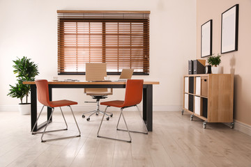 Director's office with large wooden table. Interior design