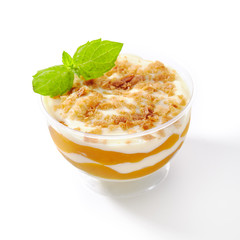Dessert with Mango, Vanilla Cream and Cookie Crumbs Isolated