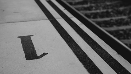 platform 1, marked on the floor of a speed bump at the train station