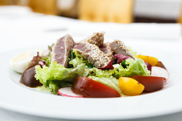 Tuna salad with tomatoes served on a plate