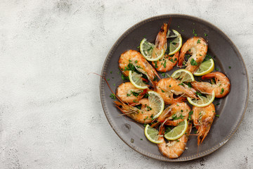 .Steamed prawns in a plate on a light background. Top view, flat lay