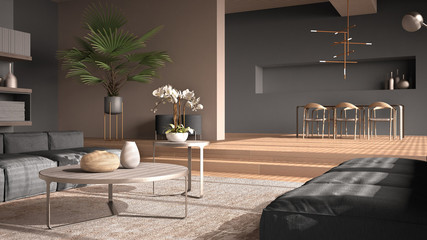 Modern living room in gray tones, hall, open space with parquet oak floor with steps, sofa, carpet and coffee tables, dining table with chairs and lamps, minimal interior design