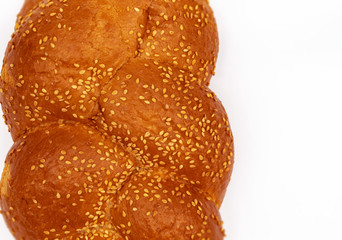 Top view of a fresh sesame loaf on a white background
