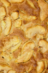 Fototapeta na wymiar Apple pie, dessert from stewed fruits, closeup, texture, background, top view. Charlotte, homemade baking