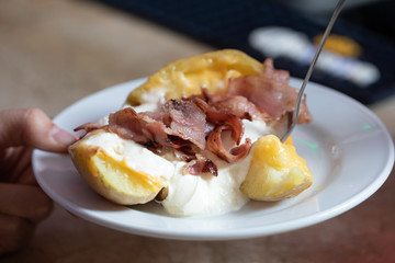 baked potato with bacon and cheese