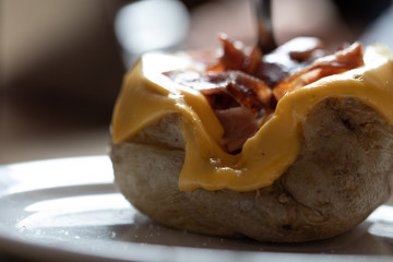 baked potato with bacon and cheese
