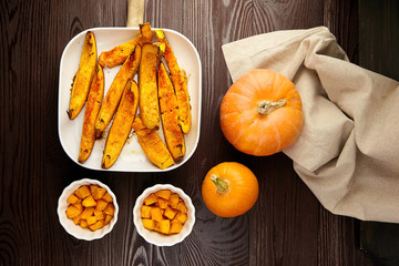 Slices of baked pumpkin in white ceramic bowl