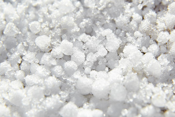 Graupel, snow pellets or soft hail texture, background. Form of precipitation, macro