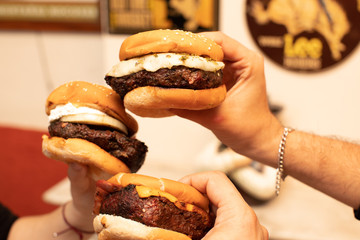hamburger for everybody a lot of hands