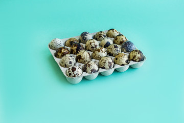 Quail eggs on a mint background Fresh quail eggs background. Natural healthy food and organic concept Easter concept