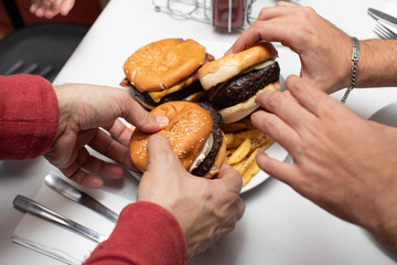 hamburger for everybody a lot of hands