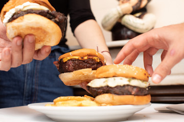 hamburger for everybody a lot of hands