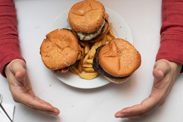 three hamburgers in a plate