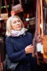 portrait of a woman in a leather store