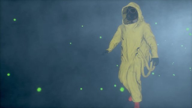 Stop biohazard. Man in a yellow hazmat suit walks through futuristic viruses. Man with bacteriological protection suit. Coronavirus, SARS-nCOV-2, COVID-19, 2019-nCOV alert. biohazard concept.