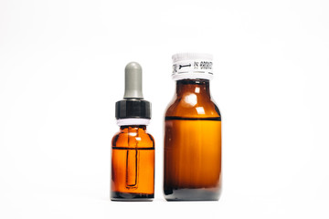 Obraz na płótnie Canvas Brown medical bottle, brown glass pharmacy bottle, dropper bottle, isolated in white background