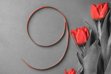 red silk ribbon shaped number nine, with tulips flower