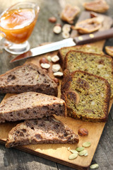 Healthy food. Bread with figs and seeds on a wooden board. Nuts, figs, honey, pumpkin seeds on a wooden background. Rustic. Background image, copy space