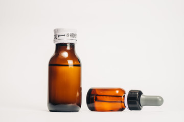 Brown medical bottle, brown glass pharmacy bottle, dropper bottle, isolated in white background