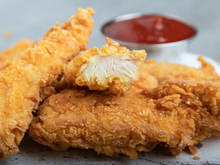 chicken strips crispy fried breaded  breast  and sauce