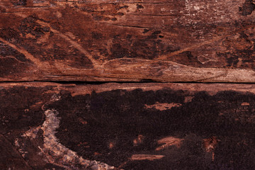 Dark brown wooden wall background.  Rough panel surface material for vintage wallpaper concept. 