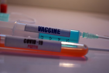 Obraz premium Vaccine for corona virus, Covid-19 testing positive for the virus, Man lab antidote Started in wuhan and now killing people in Italy