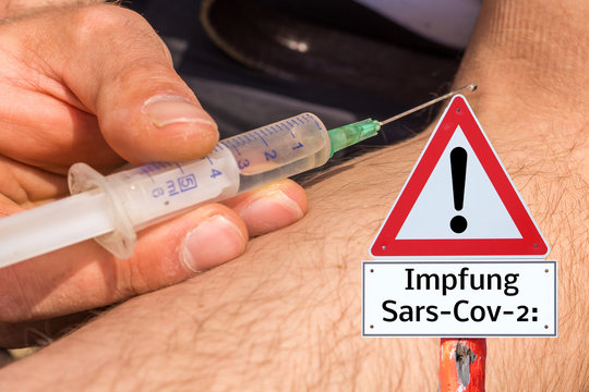Symbolbild Warnschild Impfung Sars-Cov 2