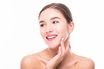 Portrait of happy smiling young woman touching skin or applying cream, isolated over white background