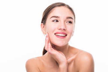 Portrait of happy smiling young woman touching skin or applying cream, isolated over white background