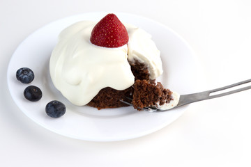 Ketogenic chocolate almond cake with whipped cream and strawberry. Low-Carb, Sugar-Free.