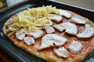 Cooking Pizza with Cheese and Chicken