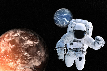 Fototapeta na wymiar Astronaut near Planets of solar system together in space. Earth and Mars, Science fiction wallpaper. Elements of this image were furnished by NASA.