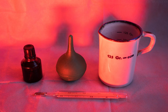 Covid-19. a thermometer, iodine and an enema are on the table in the hospital. Prevention and treatment of Chinese coronavirus