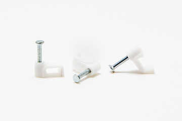 The holder for the wires on the wall isolated on white