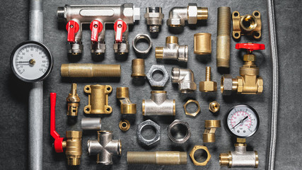 Plumbing equipment on gray flat lay background.