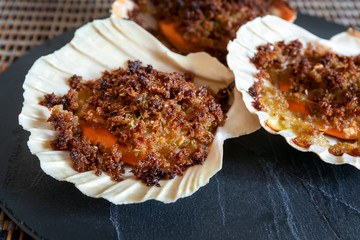 Scallops au gratin in the oven.