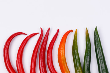 Red, yellow and green chili peppers.