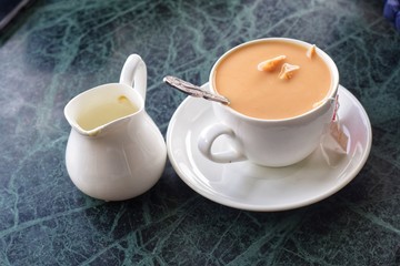 Obraz na płótnie Canvas cup of tea with teapot and cup of tea